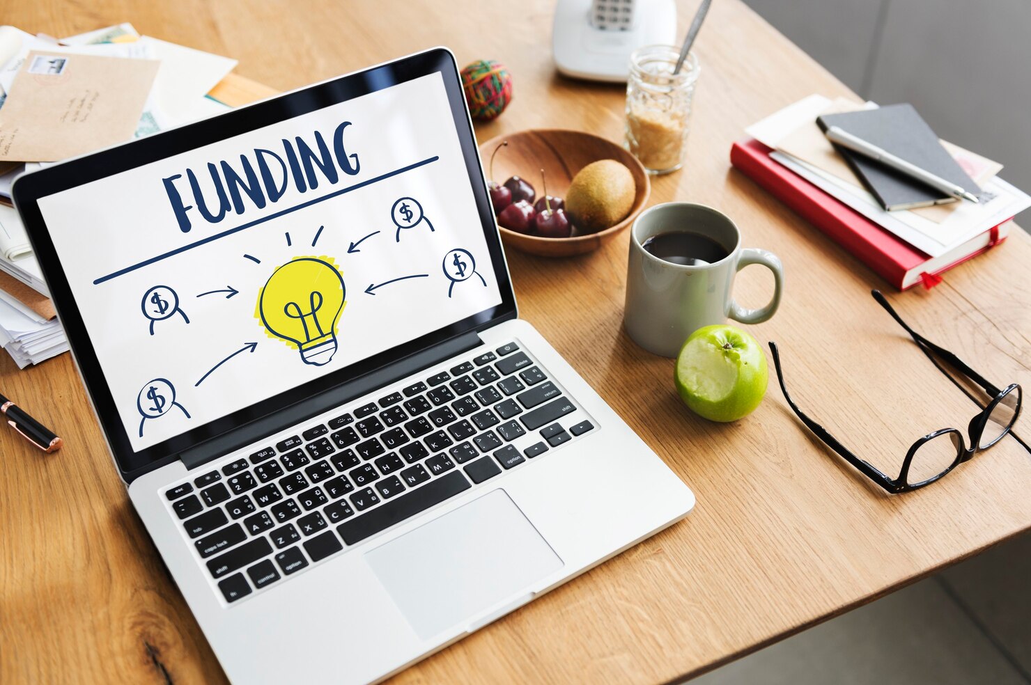 Incubation funding concept displayed on laptop showing investment ideas for startups.
