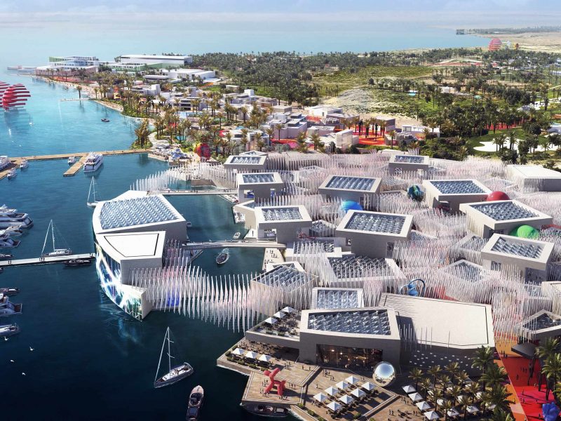 Aerial view of a complex, innovative coastal Real Estate & Giga-Projects development with marinas, leisure areas, and unique architecture.