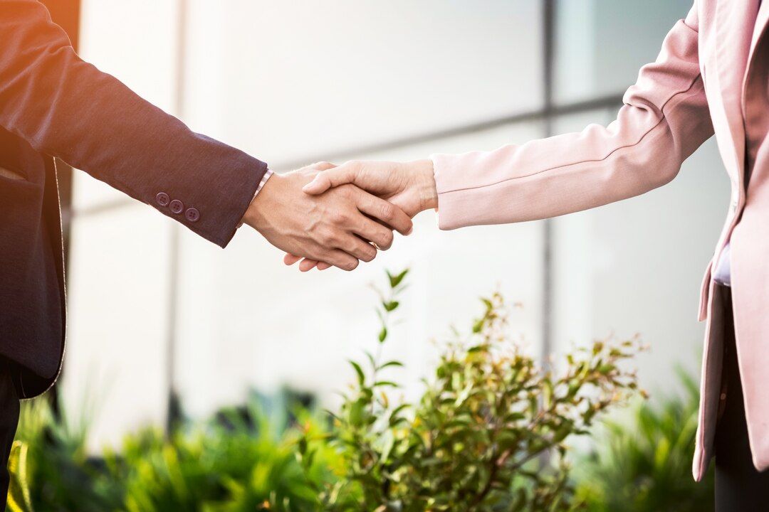 Commercial business handshake representing successful partnership and collaboration.