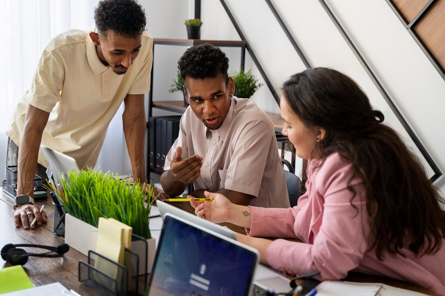 Incubation team collaborating on innovative startup strategies in a modern workspace.